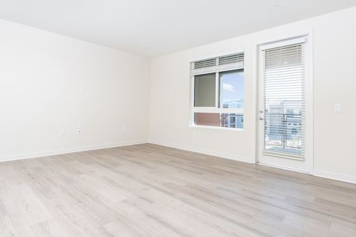 A room with a window and a sliding door.