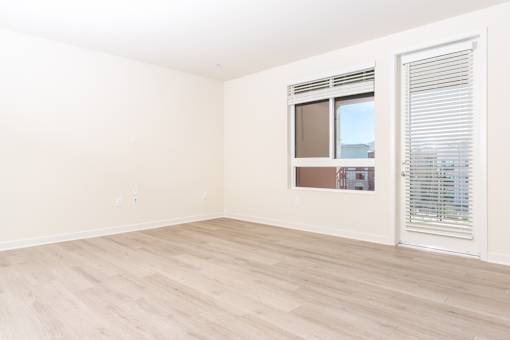 A room with a window and a sliding door.