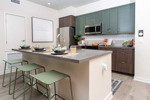 A Kitchen With a Green Bar Stool at North Grove, Riverside