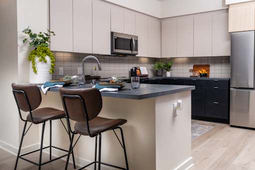 A Kitchen With Black Countertop at North Grove, Riverside, CA