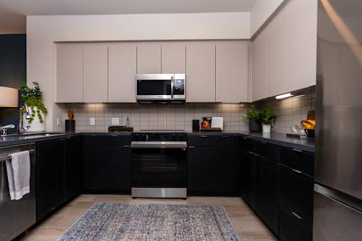 A Kitchen With Black Cabinets at North Grove, Riverside, 92501