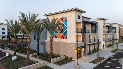 A Building With Row Of Palm Trees at North Grove, Riverside
