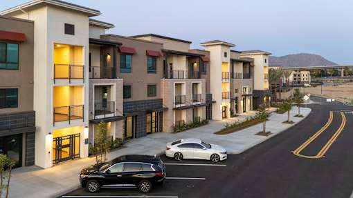 A Row Of Townhouses With Cars Parked In Front at North Grove, Riverside, 92501