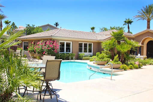 A house with a pool and a chair in front of it at Avalon at Seven Hills Apartments, Henderson, 91790