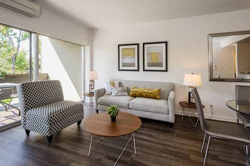 Furnished Living Room with Wood-Style Flooring and Sliding Glass Door to Patio at Palo Alto Place, Palo Alto, CA, California, 94306