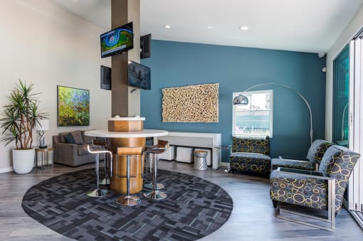 Indoor community living area with TV's at Pointe Niguel, Laguna Niguel, CA