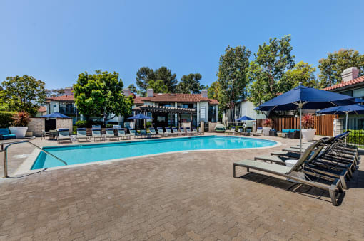 Outdoor pool area with lounge chairs at Pointe Niguel, Laguna Niguel, California