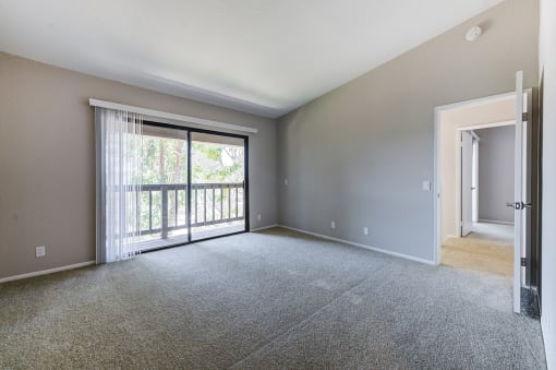 Bedroom with sliding glass doors to balcony at Pointe Niguel, Laguna Niguel, California
