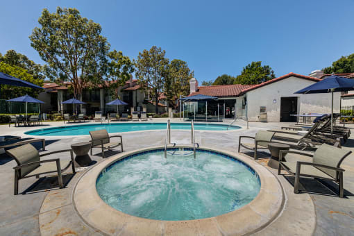 Outdoor pool and jacuzzi area with seating at Pointe Niguel, Laguna Niguel, California