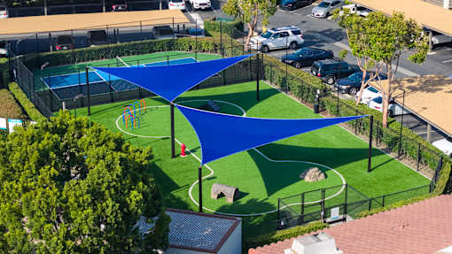 A blue shaded area is in the middle of a green field.