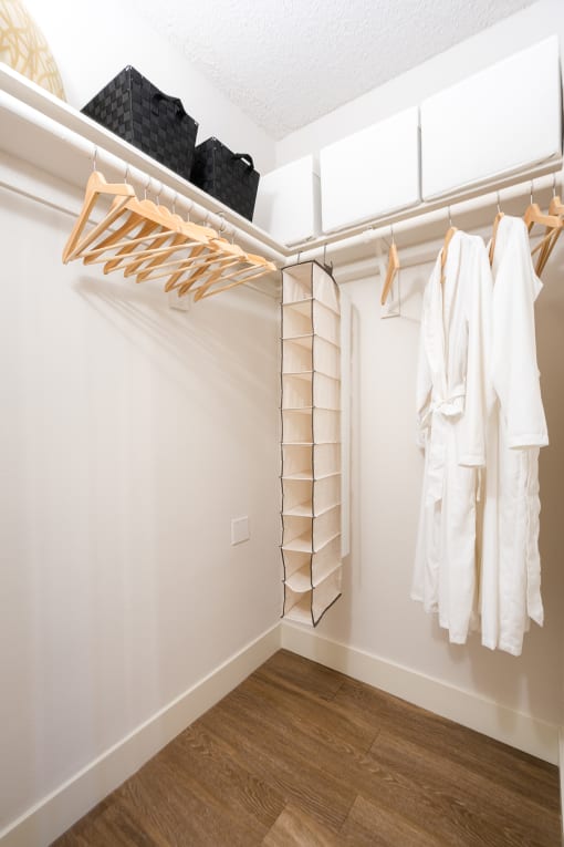 Walk in closet with wooden floors at The Preston Miracle Mile Apartments, Los Angeles, CA, California, 90036