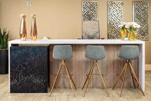 Clubroom with seating area at The Preston Miracle Mile Apartments, Los Angeles, 90036