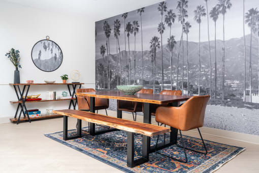 Clubroom with wooden floors at The Preston Miracle Mile Apartments, California, 90036