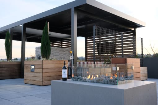 Lounge seating with fire pit at Bayswater Apartments, Burlingame, 94010