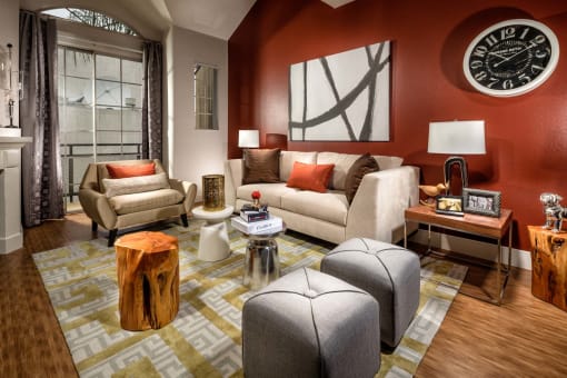 Living area with large window at The Preston Miracle Mile Apartments, Los Angeles, 90036