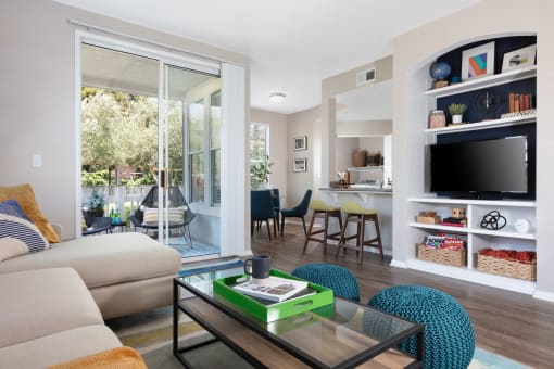 Living Area with Beige Interiors,  at Montrachet Apartments, Napa, CA, 94558Wood-Style Flooring, and Sliding Glass Patio Doors at Montrachet Apartments, Napa