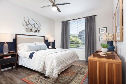 Bedroom with Large Window and Wood Style Floor at Montrachet Apartments, Napa