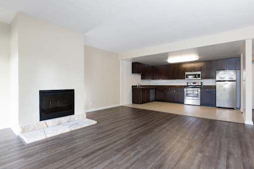 Living area with fireplace and kitchen at Palo Alto Place, Palo Alto, 94306