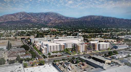 A large building with a parking lot in front of it.at Trestle, Monrovia, CA