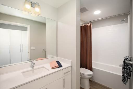 Bathroom with sink toilet and tub