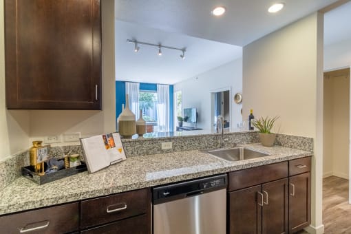 redesigned kitchen with granite counter tops and stainless steel appliances and a window at Strata at Mission Bay, San Francisco, CA, 94158