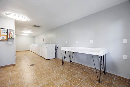 A room with a table and chairs in it.
