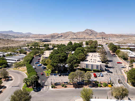 A view of a roundabout with a building in the background.