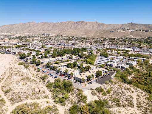 A small town with a mountain in the background.