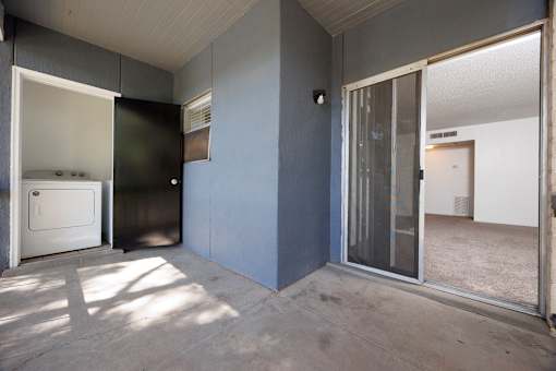 A room with a white door and a window.