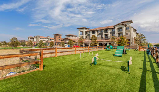 Apartments for Rent in Broomfield CO - Terracina - Outdoor Dog Park With Several Obstacle Course Items and a Fenced Perimeter