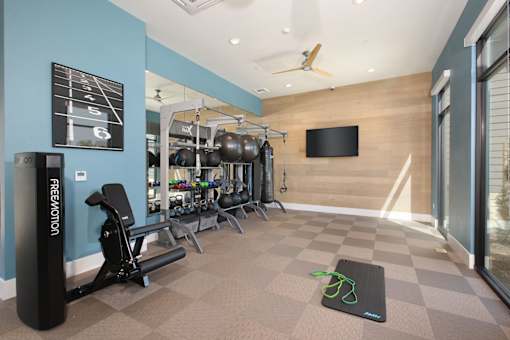 A gym with a variety of equipment