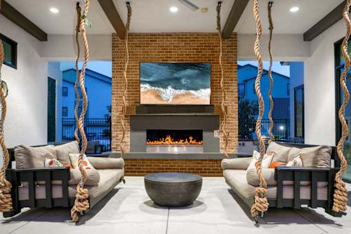 Outside fireplace with lounge seating