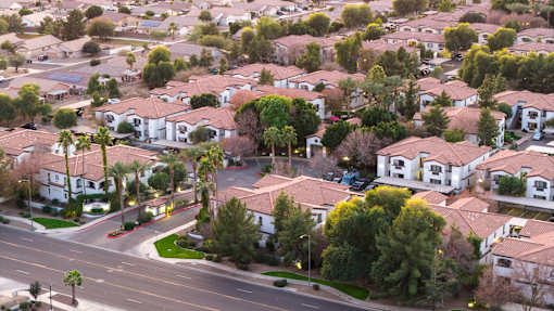 A residential area with houses and trees.