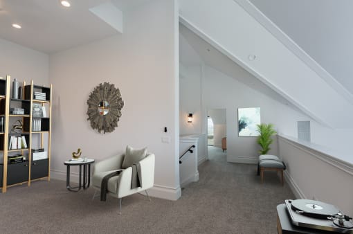 a living room with a couch and a table at Vendome Place, San Jose