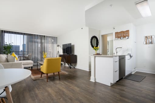 kitchen island and livingroom with seating and large windows at Vera Cortez Hill, California, 92101