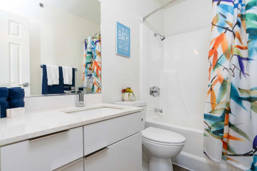 a bathroom with a shower curtain and a sink and a toilet at Vera Cortez Hill, San Diego, CA, 92101