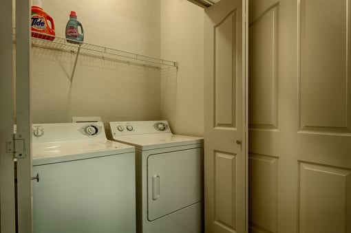 Apartments in Surprise for Rent - The Village at West Point - Laundry Closet with Washer, Dryer, Shelf, and Folding Doors.