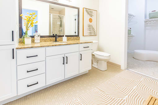 a bathroom with a sink and a toilet at Waterford RiNo, Denver