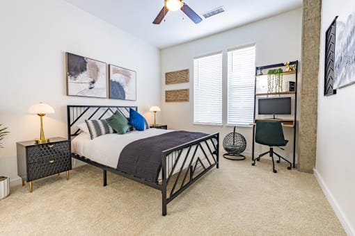 a bedroom with a bed and a ceiling fan at Waterford RiNo, Denver, CO 80216