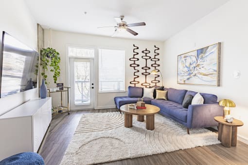Living Room with Wood-Style Plank Flooring at Waterford RiNo, Colorado