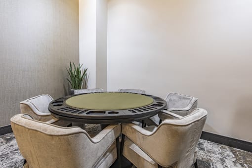 a round table for card games at Waterford RiNo, Denver