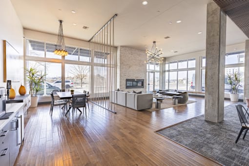 Clubroom with lounge seating and a TV at Waterford RiNo, Colorado 80216
