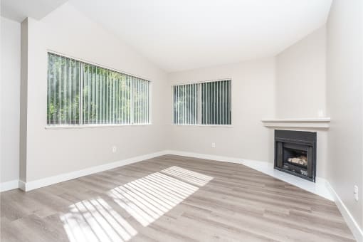 Apartments for Rent in Thousand Oaks CA - Westlake Canyon - Living Room with Wood-Style Flooring and an Interior Fireplace