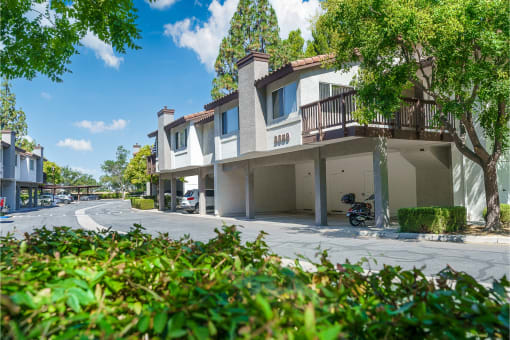 Thousand Oaks, CA Apartments for Rent - Westlake Canyon - Building Exterior with Car Ports and Surrounding Greenery