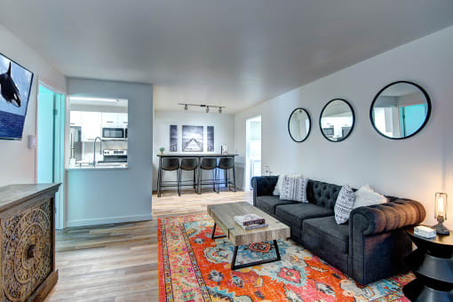 Living Room With Wood-Style Flooring And Fireplace at Woodlake Apartments, Kirkland, WA 98034