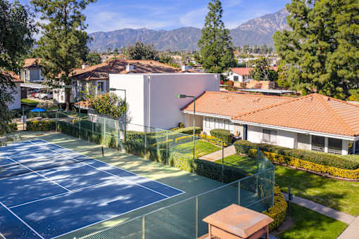 Tennis courts with mountain views and landscaping at Woodbend Apartments, Alta Loma, CA