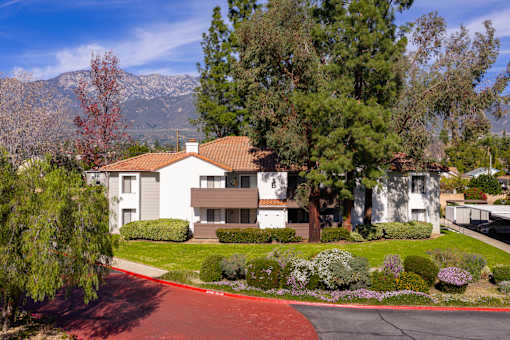 Two story residential building with mountain views at Woodbend Apartments, Alta Loma, 91701