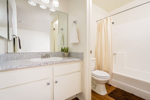Bathroom with sink, toilet and shower at Woodbend, California, 91701