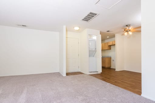 Living room, dining area with in unit washer and dryer at Woodbend, Alta Loma, 91701
