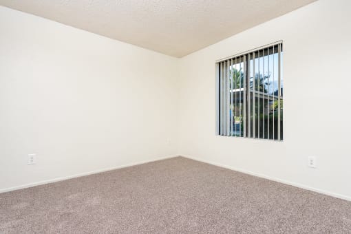 Bedroom with Carpet and Spacious Window at Woodbend, Alta Loma, California